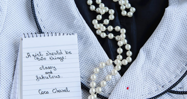 Coco Chanel Quotes Written On A Block Note, Pearl Accessories An