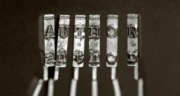 old typewriter hammers and the word AUTHOR Black background